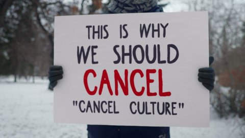 Person is Holding a Board that Says This is why we Should Cancel Cancel Culture. Raising Awareness About Online Humiliation and Shaming. Protest Against Ostracism. Defending the Humiliated Targets