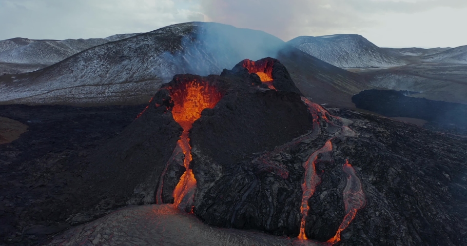 4K Drone aerial video of Iceland Volcanic eruption 2021. The volcano Fagradalsfjall is located in the valley Geldingadalir close to Grindavik and Reykjavik. Hot lava and magma coming out of the crater | Shutterstock HD Video #1069962358