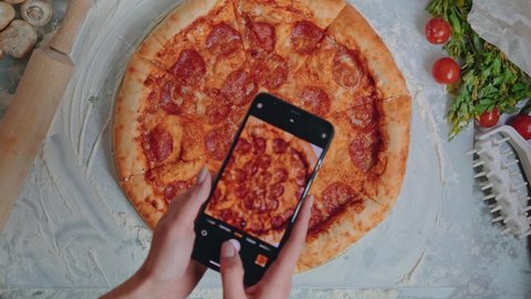Technology, People And Food Porn Concept. Taking Picture Of Pizza With Smartphone.