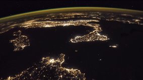 Beautiful time lapse of Earth seen from space at night time featuring thunders and auroras over city lights. Image courtesy of NASA.