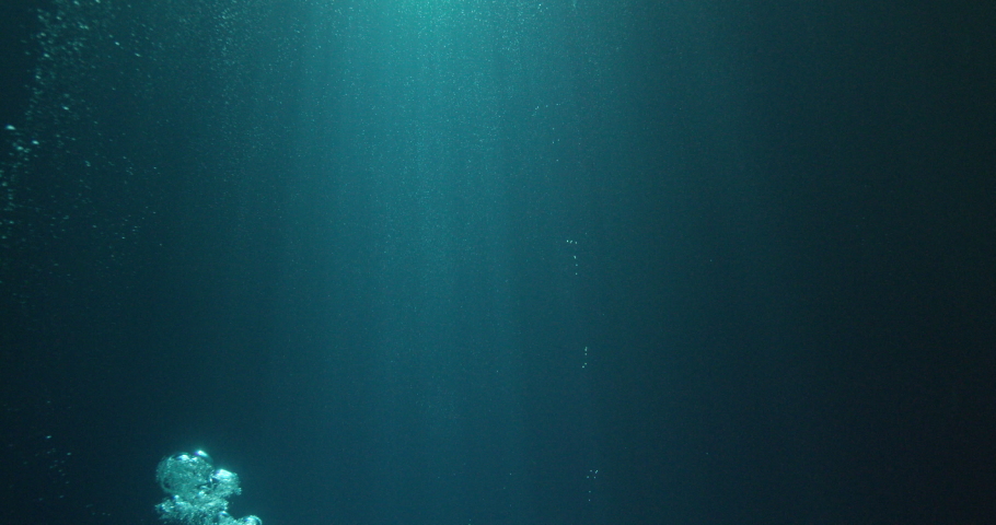 Sun beams and bubbles underwater