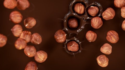 Super Slow Motion Shot of Hazelnuts Falling into Melted Chocolate at 1000 fps.