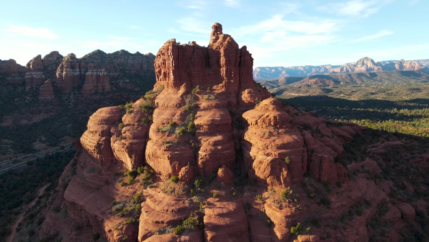 Aerial approaching Bell Rock mountain formation on a clear day with blue skies, Arizona. | Shutterstock HD Video #1069989559