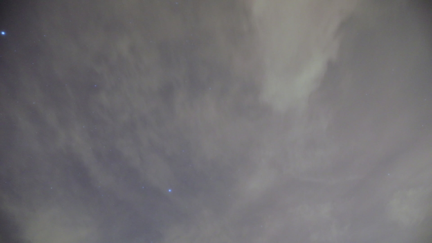 Night time sky timelapse, stars above clouds