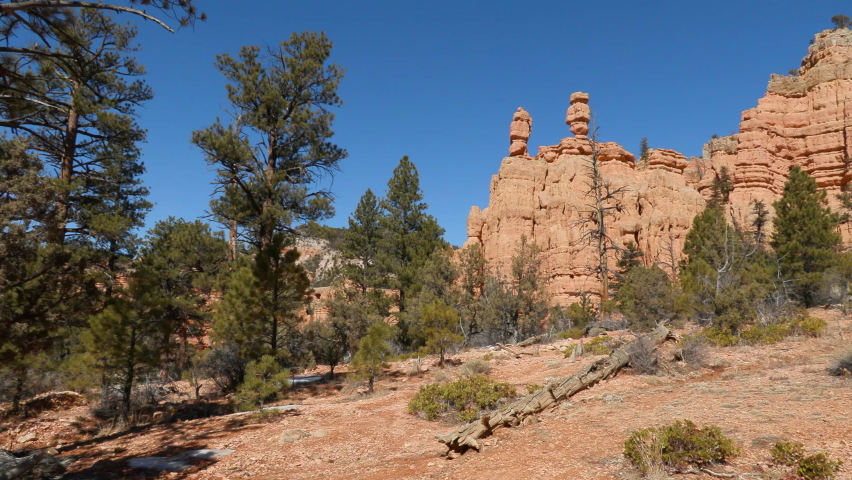 Establishing of red rock sandstone formations near the Red Canyon Visitors Center on Highway 12, gateway to Bryce Canyon National Park, Utah.  Shot in UHD on a sunny day.
