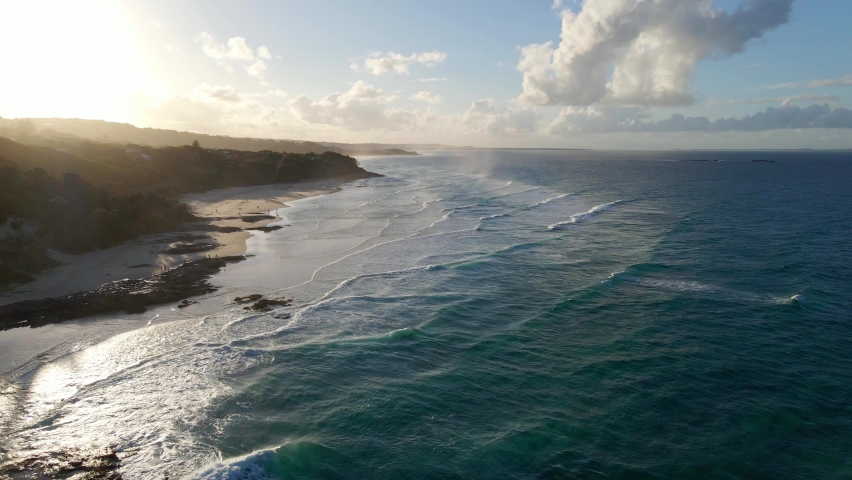 Beautiful Waves In Cylinder Beach At Sunrise In Summertime - Ocean Waves - Point Lookout, QLD, Australia. - aerial Royalty-Free Stock Footage #1070006551