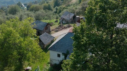 Traditional slate stone tiling roof on old European rural cottage buildings