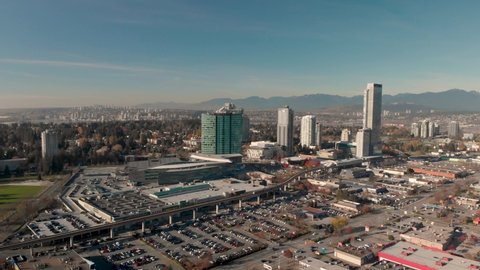 Drone 4K Footage Above Surrey panoramic shot of a city center of high rise buildings downtown cityscape maintaining air quality