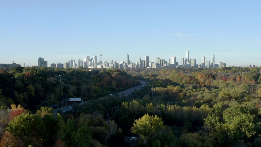 Cinematic aerial view over the Don Valley Parkway with the Toronto Skyline in the back. Drone Toronto, Ontario