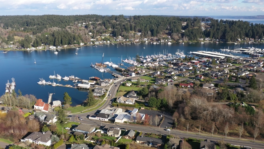 Cinematic panoramic panning aerial drone clip of Gig Harbor, a quaint, historic, charming tourist destination in the Pacific Northwest, near Tacoma, Washington