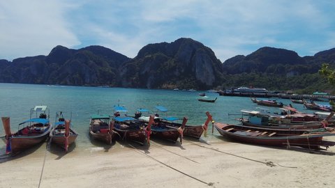 Maya Bay, the beach with long-tail boats and tourists at Summer time, Phi Phi Lay Island, Krabi Province, Thailand, Southeast Asia, Asia