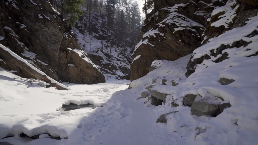 Deep Gorge in Winter. River Canyon Covered with Snow
