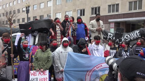 WASHINGTON, DC - APR. 1, 2021: Indigenous chant at rally demanding.  Pres. Biden revoke the Army Corps permits for Line 3, and shutdown the Dakota Access Pipeline, and to replace the dependence on oil