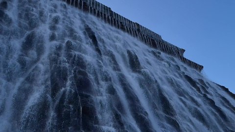 December 2020: Stunning Khorfakkan artificial waterfall in Sharjah, The new tourist destination in United Arab Emirates. 4K Footage