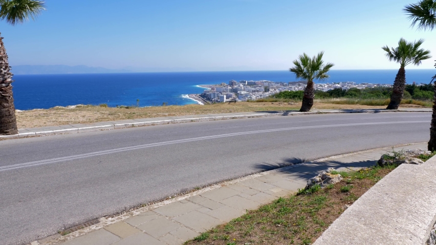 the new town of Rhodes niochori from above and a cyclist passing by