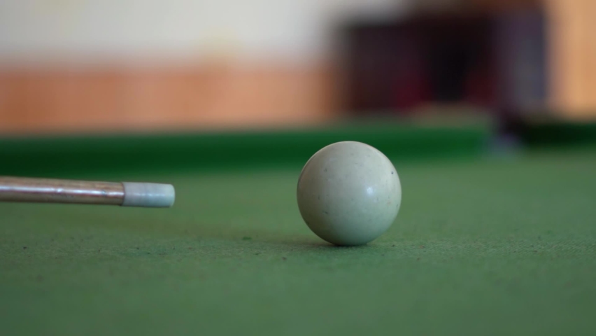 Closeup slow motion shot of cue shooting snooker ball on the snooker table. | Shutterstock HD Video #1070066860