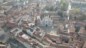 Aerial video in 4K of facade of the ancient Duomo in Monza (Monza Cathedral). Drone footage of the main square with church in Monza in north Italy, Brianza, Lombardia.