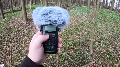 Ostrava CZ march 28 2021. Turning on and recording forest sounds on the recorder Tascam DR-05x.