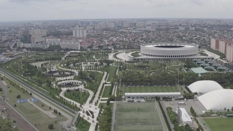 D-Log. Krasnodar, Russia - August 28, 2020: Krasnodar - football stadium of the eponymous club in the city of Krasnodar. Public Park Krasnodar (Galitsky Park). Summer aerial view, Aerial View