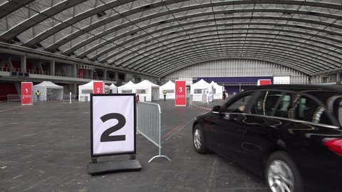 AMSTERDAM, NETHERLANDS – 15 MARCH 2021: People can vote from their car in drive-through polling station in Amsterdam, Netherlands. General elections with extra Covid-19 coronavirus precautions.
