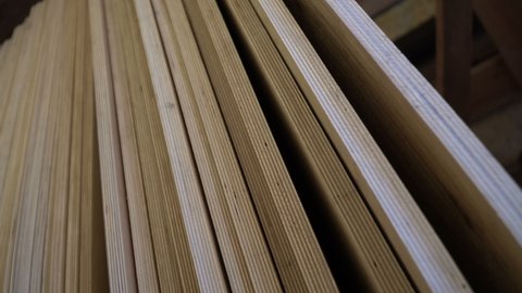 Plywood in stock. Sheet building material for the construction of partitions. Wooden plywood for building a house.