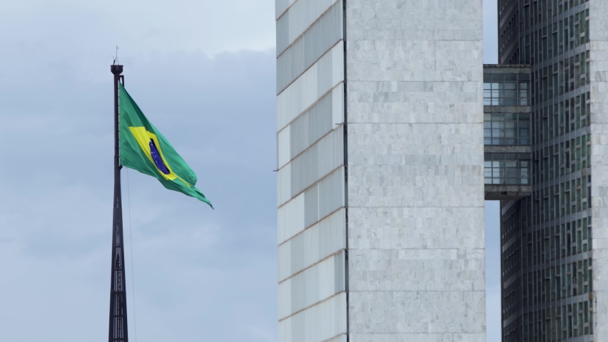 Brazilian flag flying over the national congress in Brasilia, DF, Brazil, elections in Brazil, flag fluttering Royalty-Free Stock Footage #1070112538