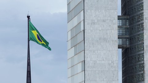 Brazilian flag flying over the national congress in Brasilia, DF, Brazil