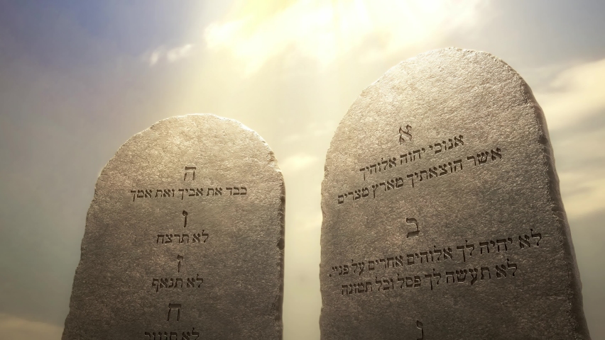 Golden letters of the Ten Commandments on the stone tablets. God told Moses about the Ten Commandments on the stone tablets. Excerpted from the Bible, Exodus 20:1-17, 3D rendered animation. Royalty-Free Stock Footage #1070117611