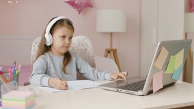 Schoolgirl Girl Studies Online On Laptop At Home