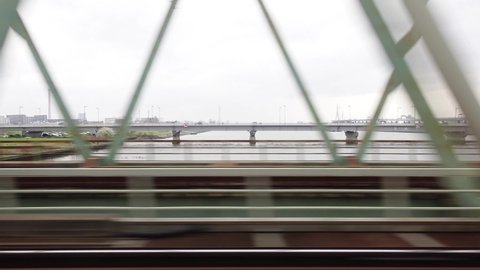Scenery from the train window of a Japanese train.Near Arakawa.