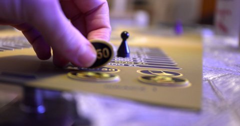 Player uses a lifeline 50 50 in who wants to be a millionaire board game polish version male hand