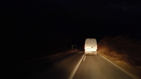 Suspicious white van drive fast on road at night doing illegal trafficking, transportation- Illegal activities, stolen and hidden merchandise 