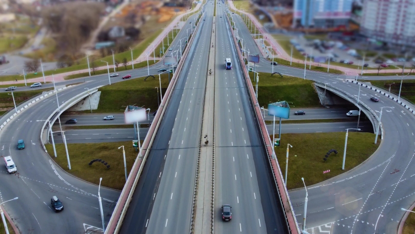 Autonomous Self Driving Cars Moving Through City Highway. Speed and identity Control System. Future transportation. Artificial Intelligence Digitalizes and Analyzes Road. Shot from drone. Royalty-Free Stock Footage #1070161390
