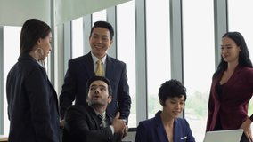 multiracial business group including asian and caucasian  standing and talking together in office of international corporate. diversity in business concept - Powered by Shutterstock - Get 15% off with code: PIKWIZARD15