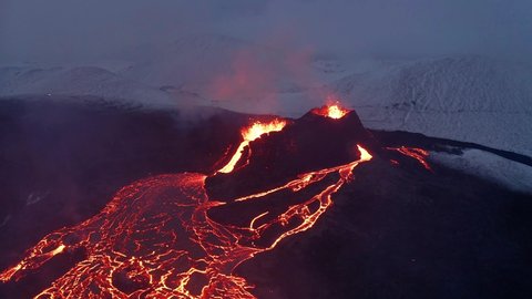 River of hot lava flowing from an erupting Fagradalsfjall Volcano in South Iceland -aerial
