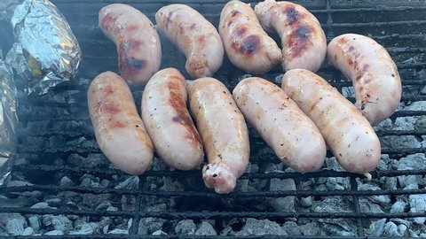 Barbecue braai pork sausages and mielies over hot coals