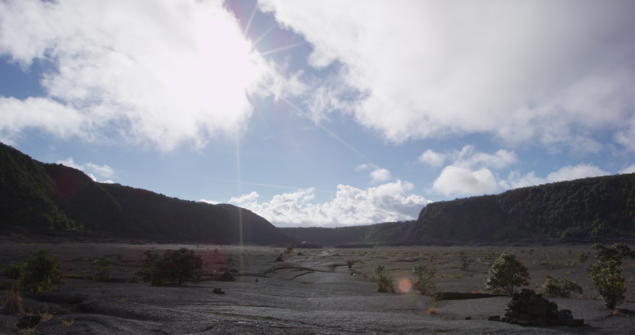 Hawaii tourists hikers walking on Kilauea Iki crater trail hike in Big Island, Hawaii. USA summer travel vacation destination for outdoor nature adventure, american tourism.