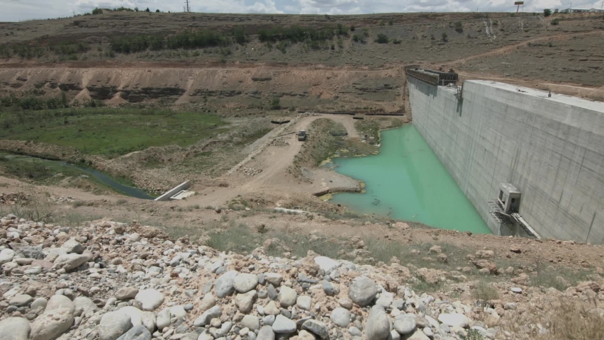 Dam construction work. Workers working in teams at the construction site. Earthmoving shed trucks. Construction worker. 20 June 2018 TURKEY
