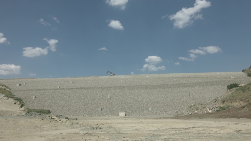 Dam construction work. Workers working in teams at the construction site. Earthmoving shed trucks. Construction worker. 20 June 2018 TURKEY