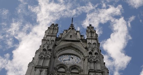 View of the main cathedral tower in the center of Quito, Ecuador. Clouds moving in the sky background