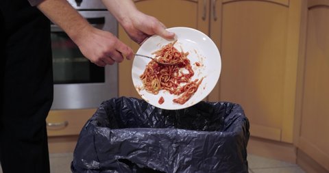Food leftower thrown in the kitchen garbage bin, food waste problem