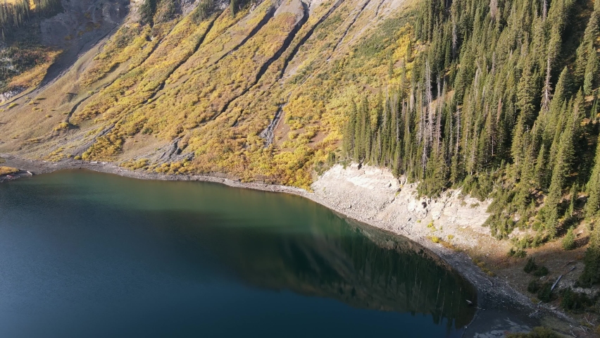 Aerial view Tilting Upshot, Scenic view of Emerald Lake in Schofield Pass, Crested Butte, Colorado Springs, Mount Baldy in the background.