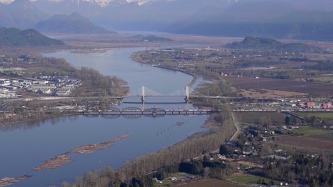 Canadian Pacific Railway And Pitt River Bridge Connecting Port Coquitlam And Pitt Meadows In British Columbia, Canada. aerial