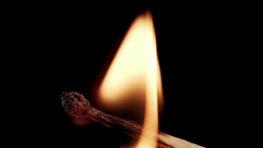 Closeup Match burning and combusting on black background. The match lights up, burns, and goes out. Burning match stick lights and then blown out. Slow motion, isolated on a black background. | Shutterstock HD Video #1070214919
