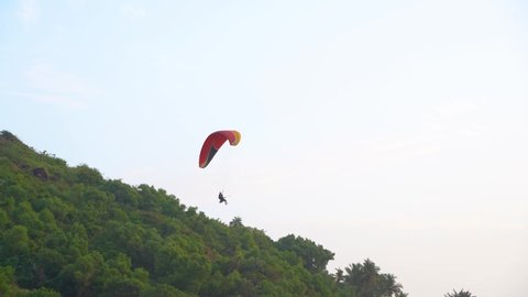 Paragliding on a sunny day in India.