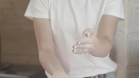 Hand clap of woman hands splash flour rolling pin on rose slow motion video