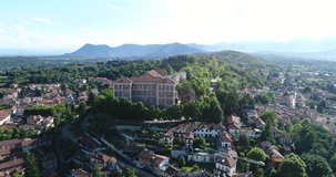 Flying over Rivoli's Castle in Turin, contemporary art museum. In a sunny day no clouds. Drone DJI Phantom 4Pro - 4k, cine profile