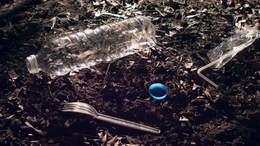 Time-lapse of long lifecycle of plastic trash in soil. Environmental problems, soil pollution and ecology concept. | Shutterstock HD Video #1070241061