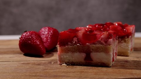 Fresh strawberry cake with cream in close-up - studio photography