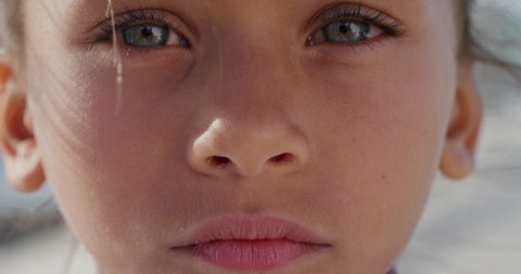 Portrait of sad mixed race girl child staring